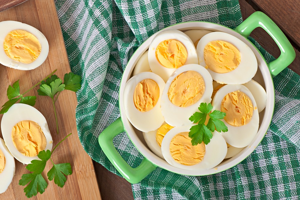 boiled eggs bowl decorated with parsley leaves